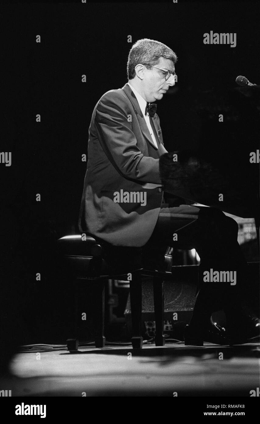 Composer & musician Marvin Hamlisch is shown performing on stage during a 'live' concert appearance. Stock Photo