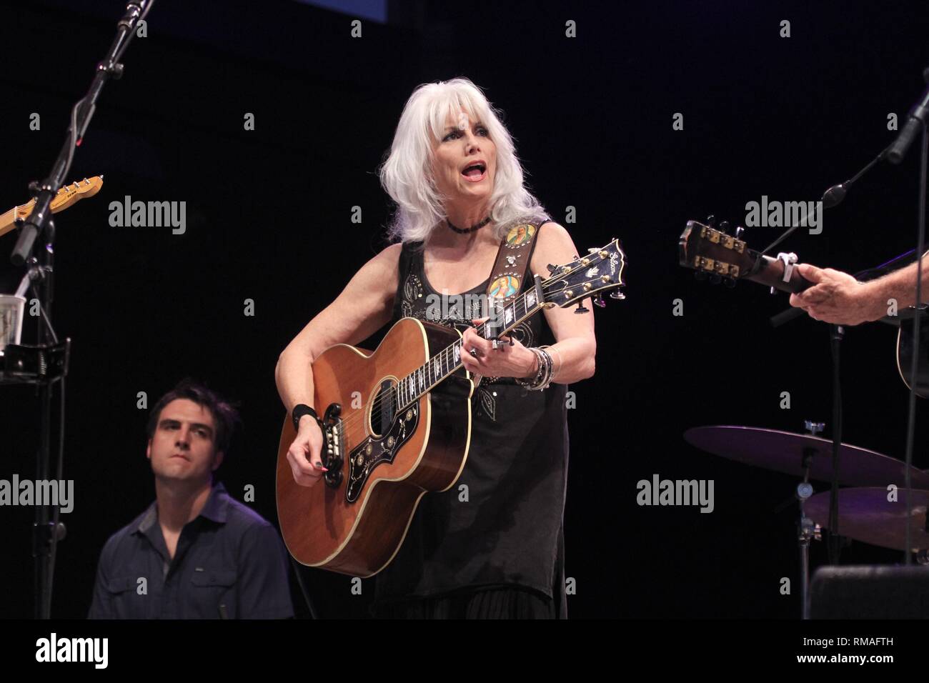 Singer, songwriter and guitarist Emmylou Harris is shown performing on stage during a 'live' concert appearance. Stock Photo