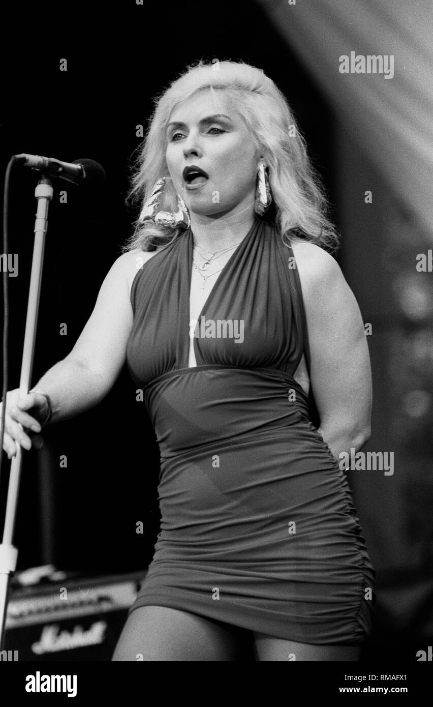 Singer, songwriter and actress Debbie Harry, best known for being the lead singer of the punk rock and new wave band Blondie, is shown performing on stage during a 'live'concert appearance. Stock Photo