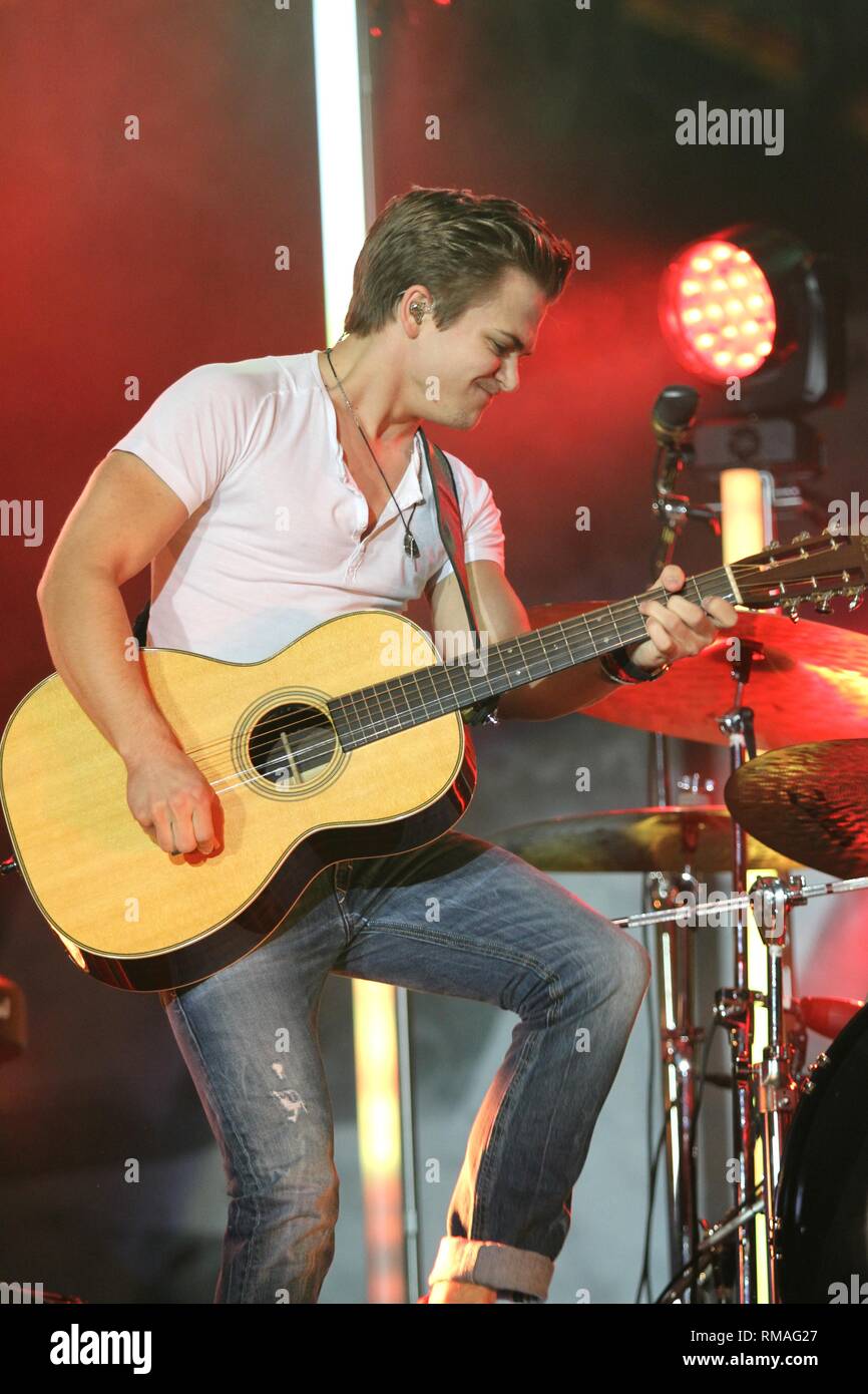 Singer, songwriter and guitarist Hunter Hayes is shown performing onstage during a 'live' concert appearance. Stock Photo