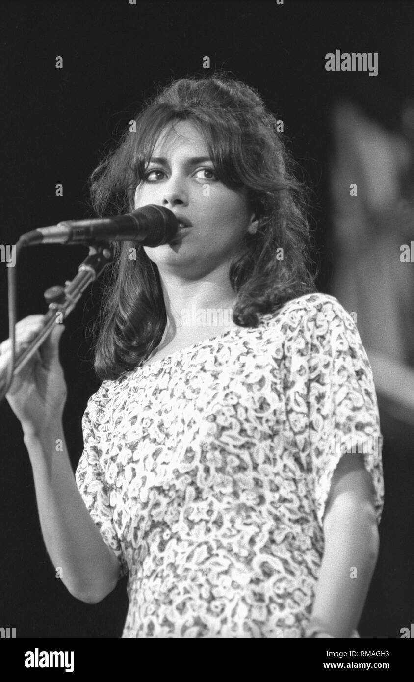 Vocalist, guitarist and actress Susanna Hoffs, best known as a member of the all female pop band The Bangles, is shown on stage performing with her solo band. Stock Photo