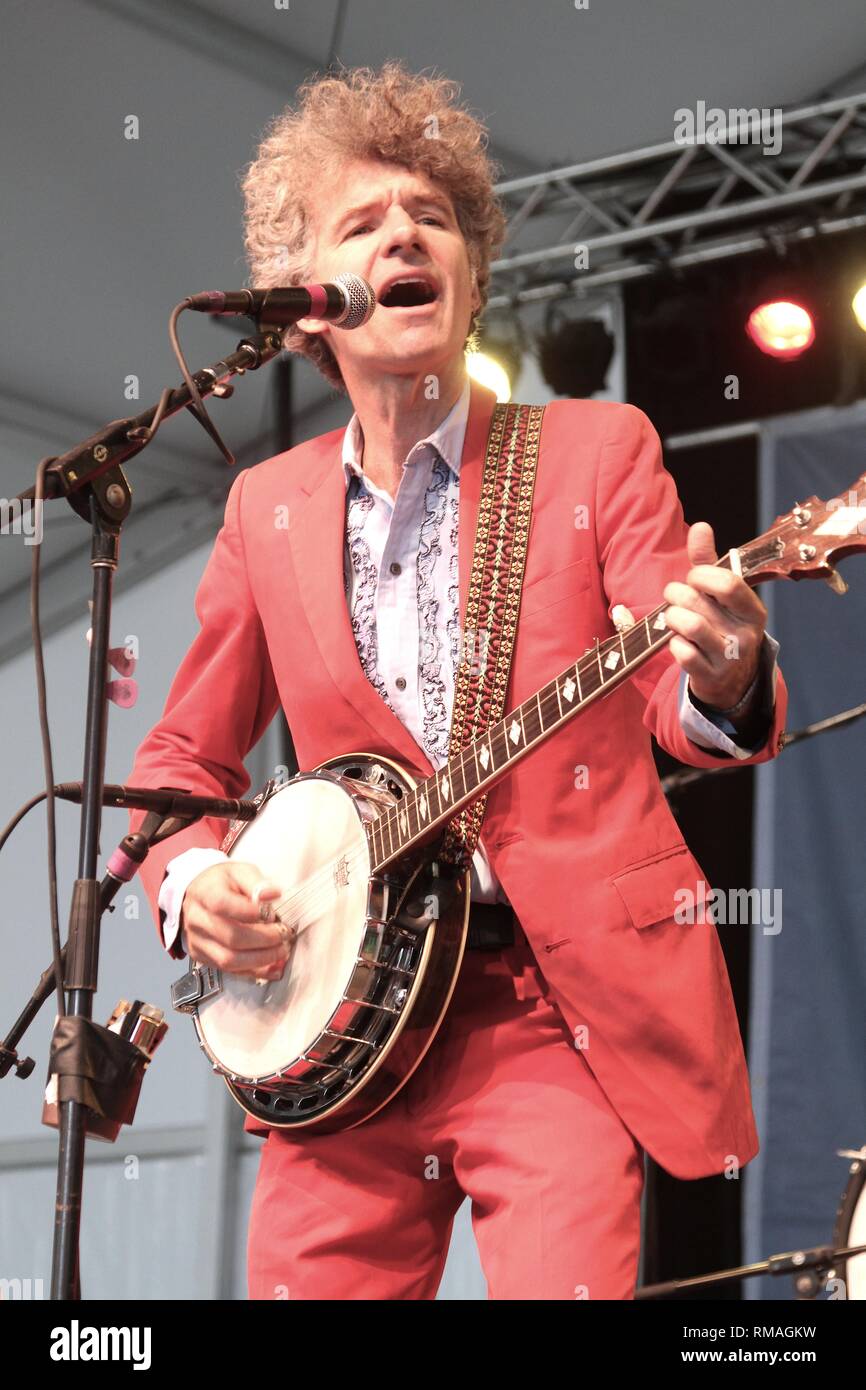 Musician Dan Zanes is shown performing to a large group of children