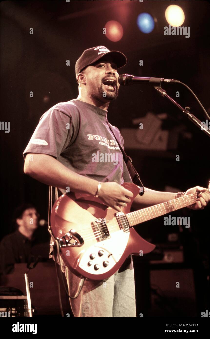 Singer and guitarist Darius Rucker of Hootie & the Blowfish is shown performing on stage during a 'live' concert appearance. Stock Photo