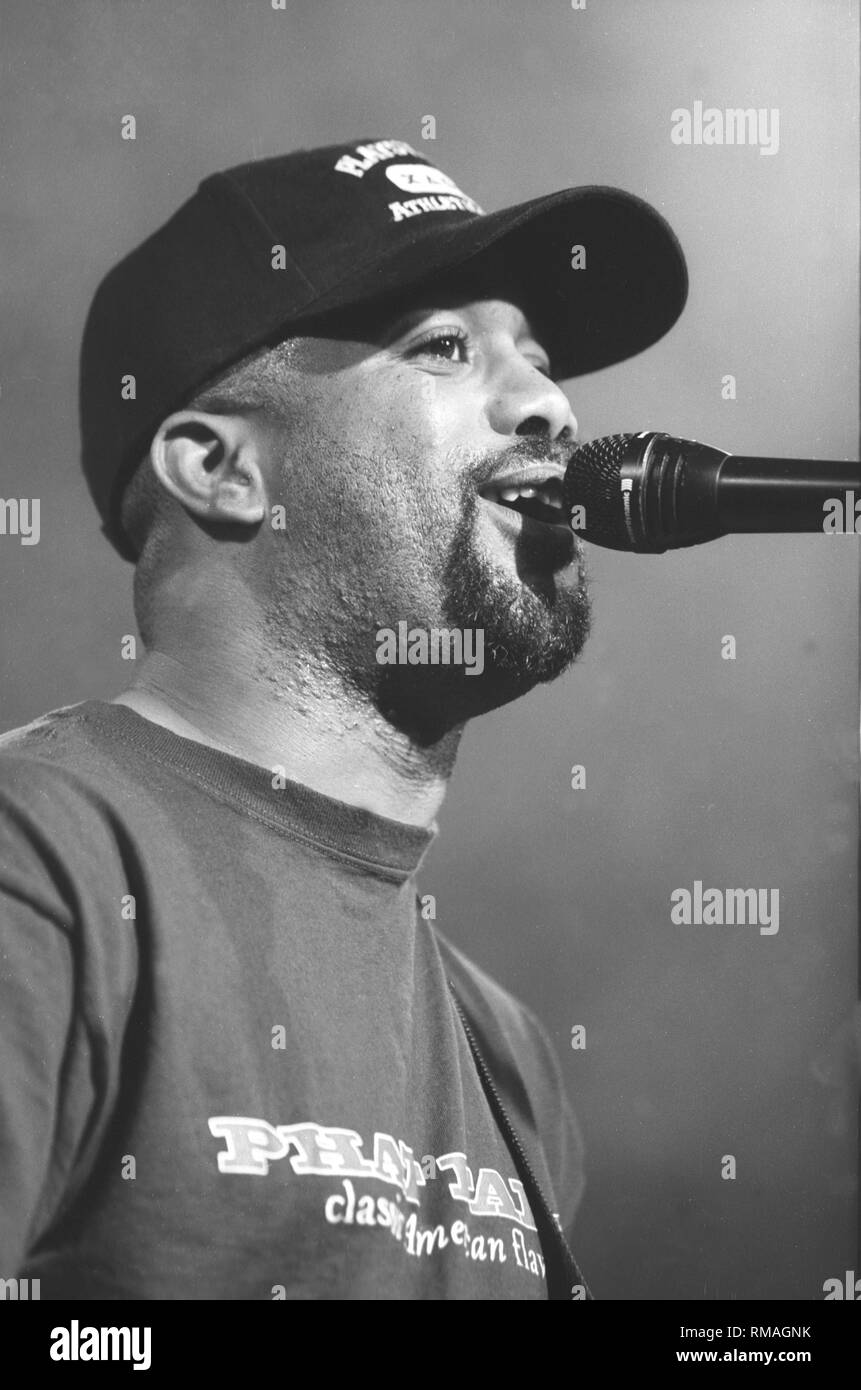 Singer and guitarist Darius Rucker of Hootie & the Blowfish is shown performing on stage during a 'live' concert appearance. Stock Photo