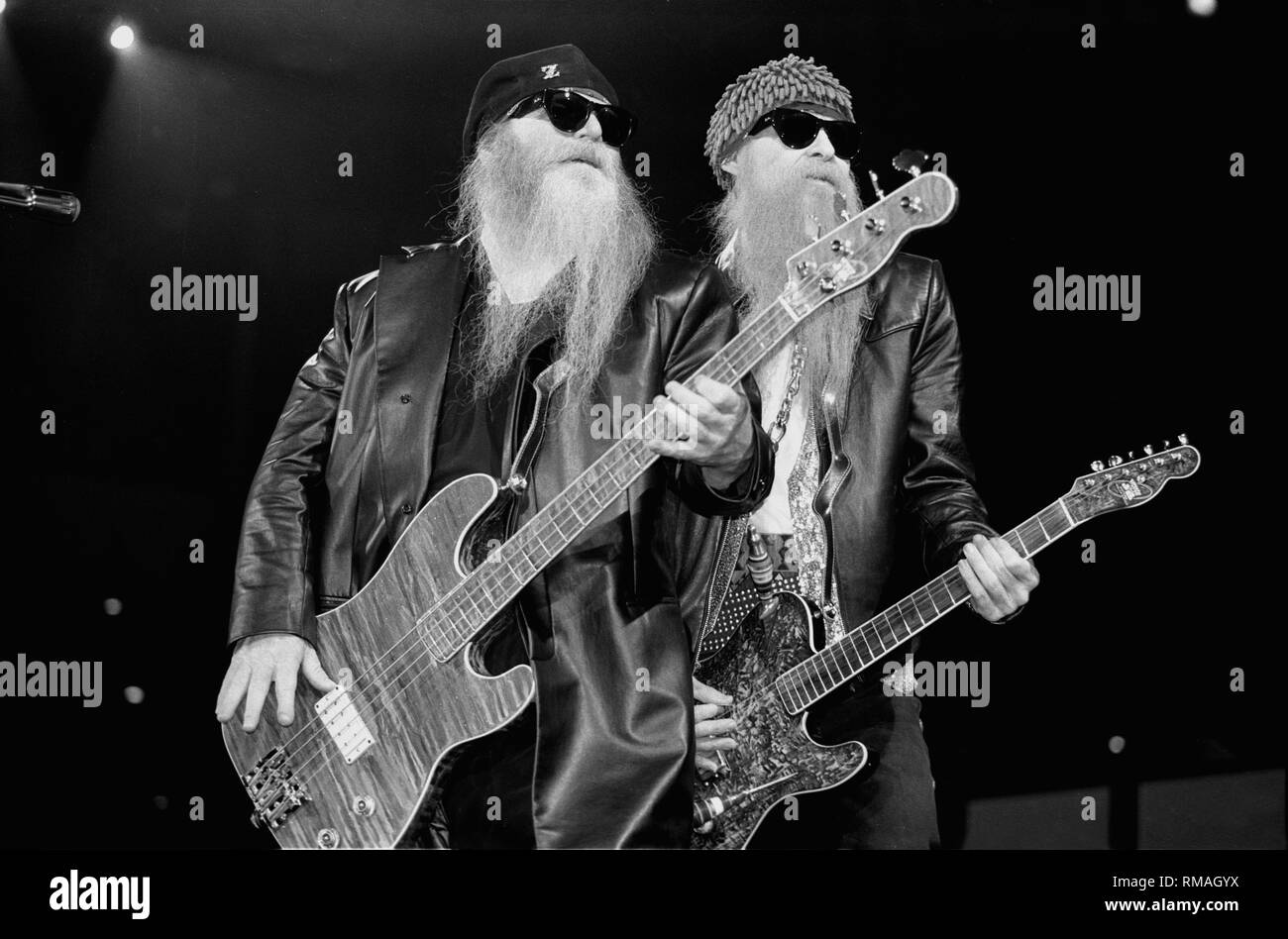 Musicians Dusty Hill and Billy Gibbons of the rock band ZZ Top are shown performing on stage during a 'live' appearance. Stock Photo