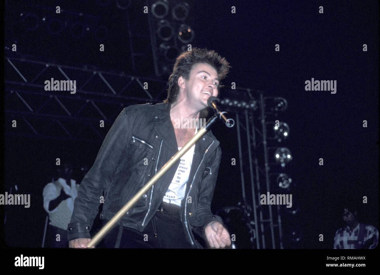 English pop singer Paul Young is shown performing on stage during a 'live' concert appearance. Stock Photo