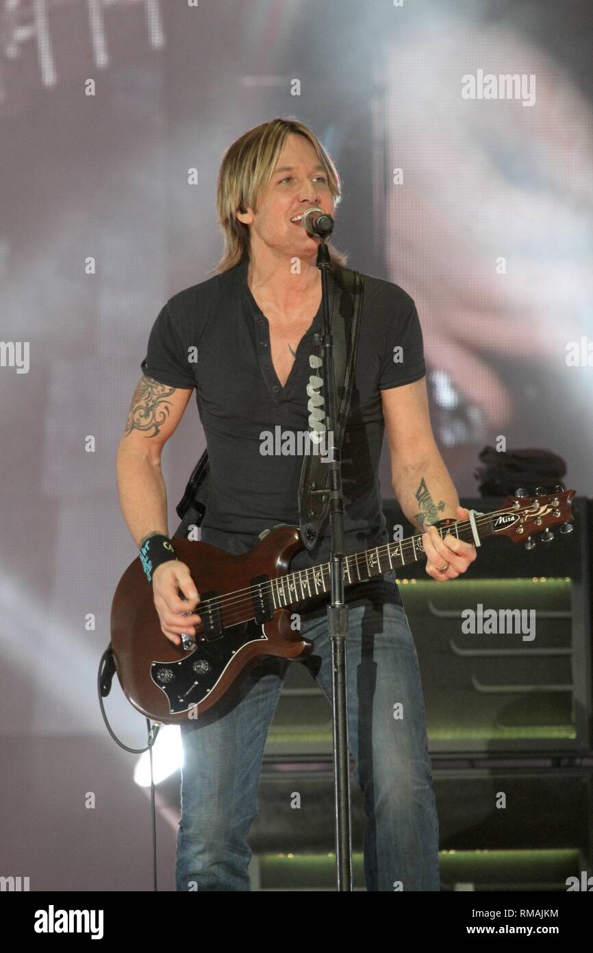 Musician Keith Urban is shown peforming on stage during a 'live' concert appearance. Stock Photo