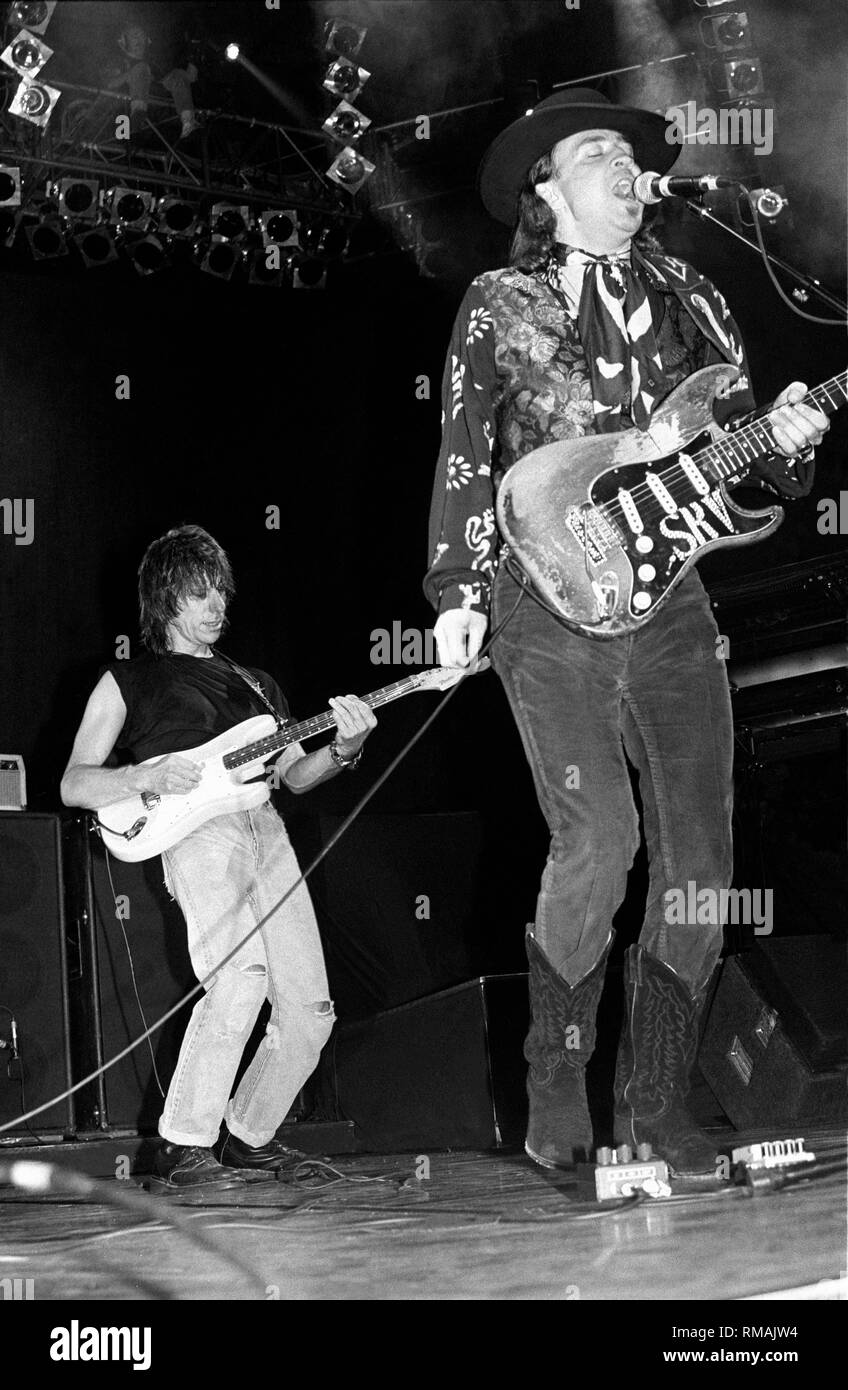 Guitarists Stevie Ray Vaughan and jeff Beck are shown performing together on stage during a 'live' concert appearance. Stock Photo