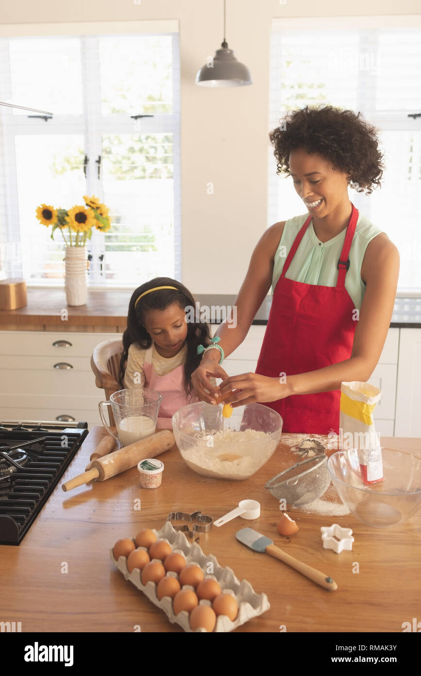 African American mother and daughter baking cookies in kitchen Stock ...