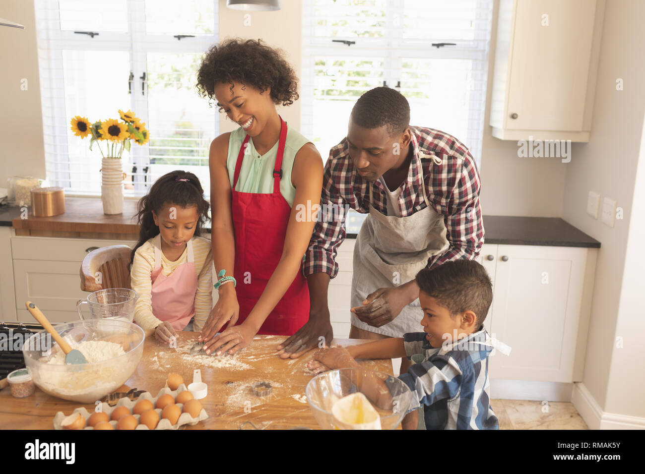 African American family baking cookies in kitchen Stock Photo - Alamy