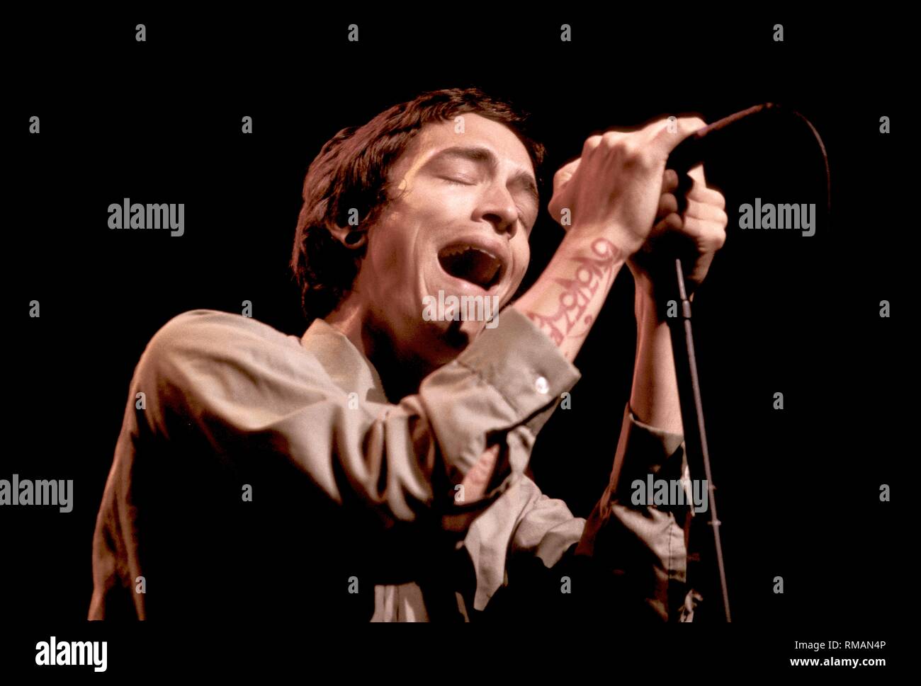Singer Brandon Boyd of the rock band Incubus, is show performing on stage during a 'live' concert appearance. Stock Photo
