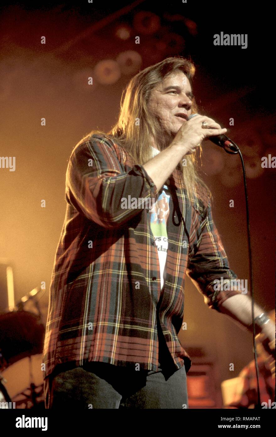 Vocalist of the Kentucky Headhunters is shown performing on stage