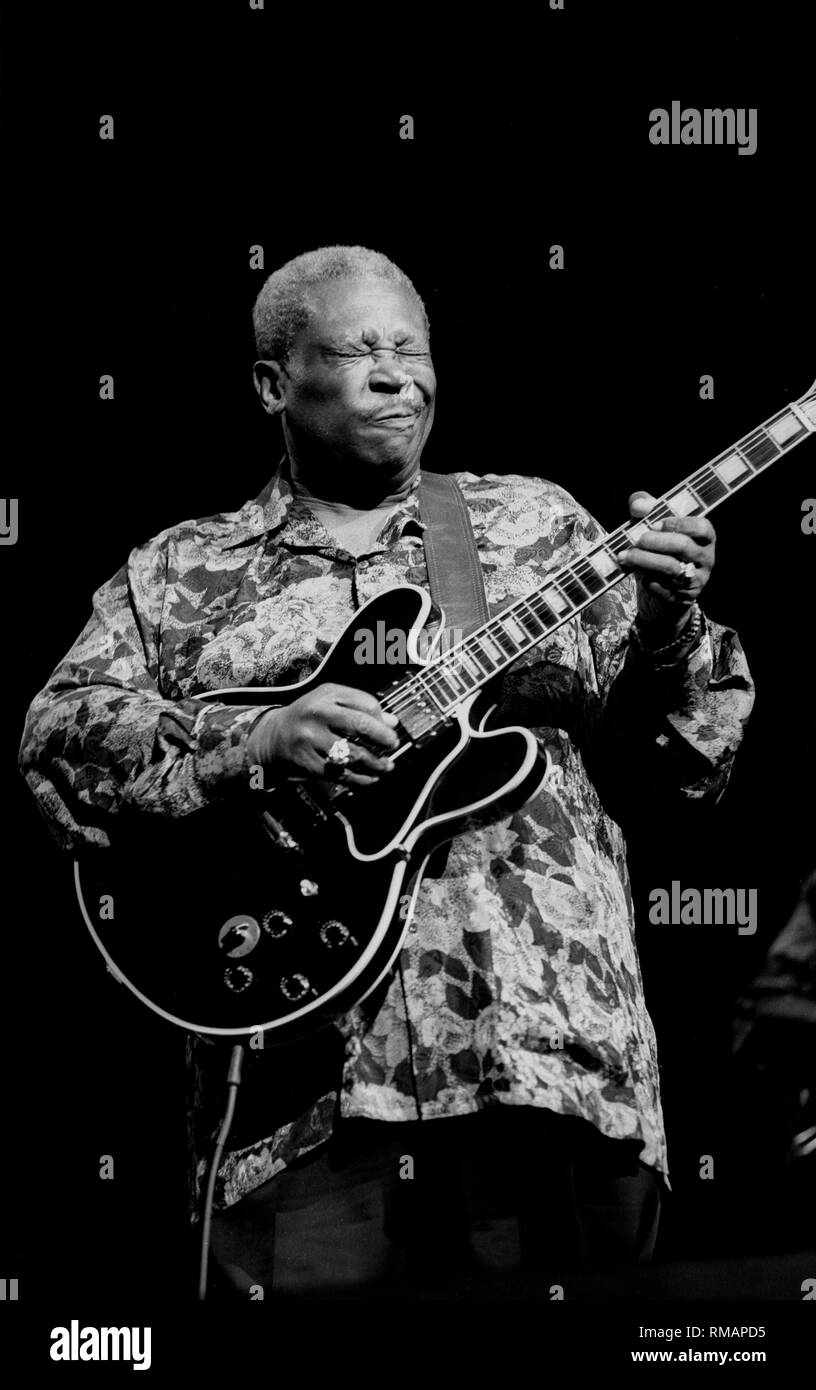 Blues guitarist . King is shown performing on stage during a 