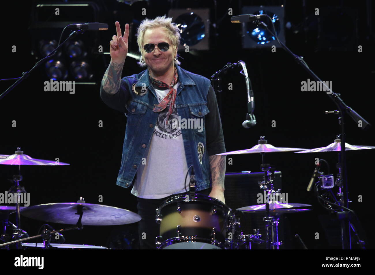 Drummer Matt Sorum is shown performing on stage during a 'live' concert with the Kings of Kaos. Stock Photo