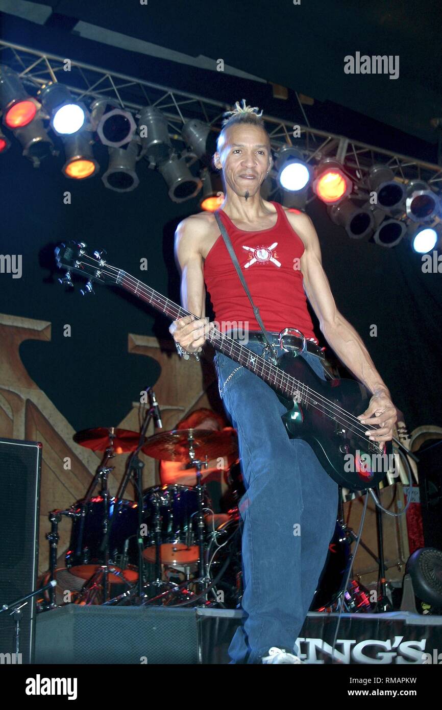 Bassist Doug Pinnick of the progressive metal band Kings X is shown performing on stage during a 'live' concert appearance. Stock Photo