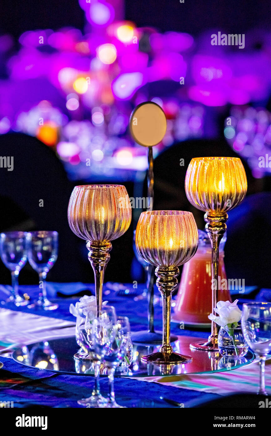 Table setting with candles at gala dinner Stock Photo Alamy