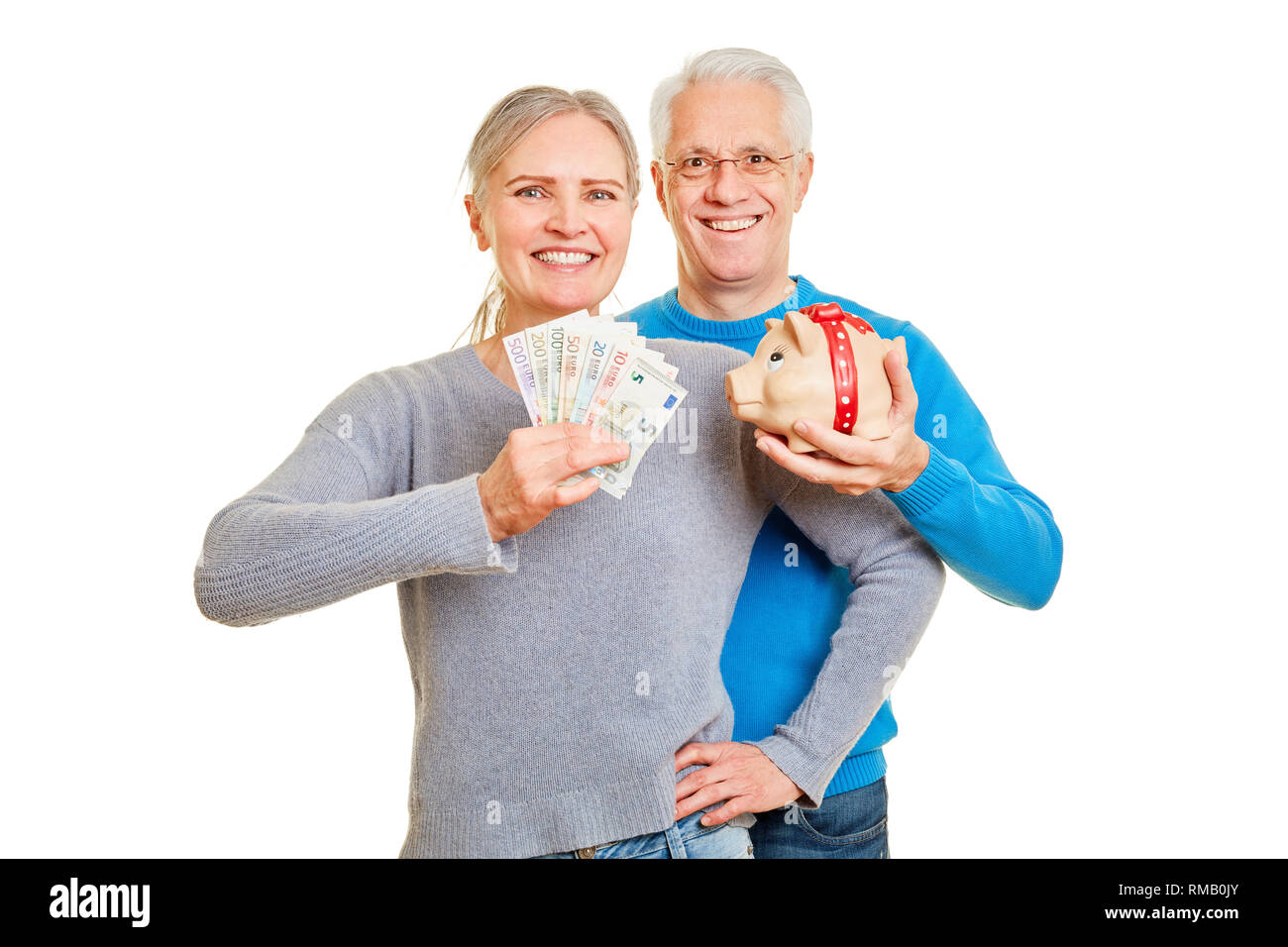 Happy couple of seniors with piggy bank and euro bills in hands Stock ...