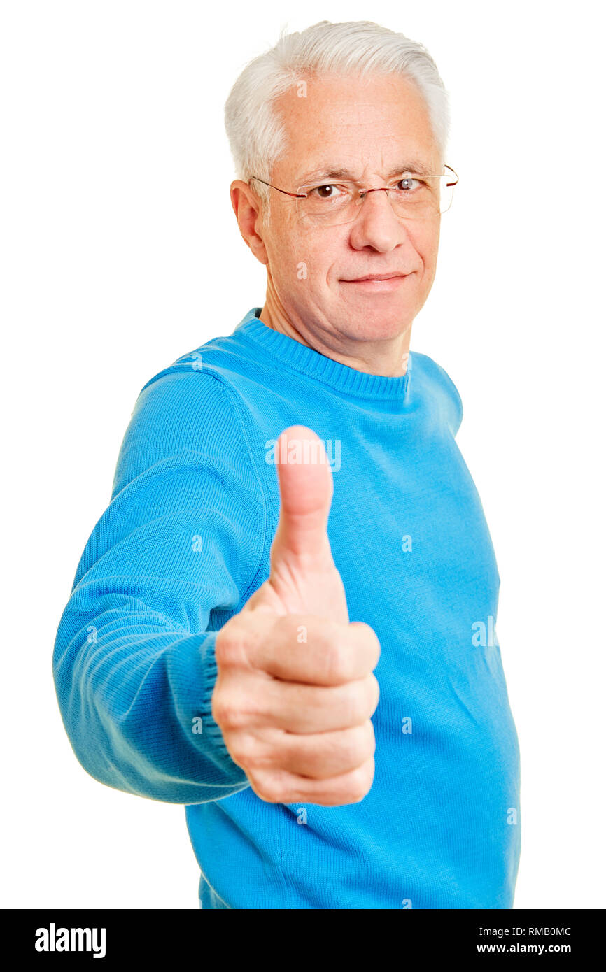 Senior man holds thumbs up for congratulation and approval Stock Photo