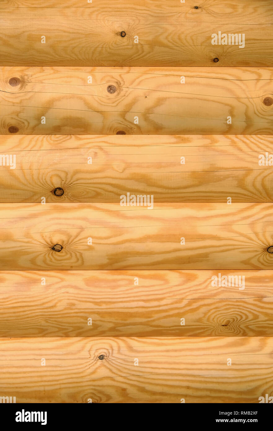 Background of horizontal hewed smooth painted wooden logs close up vertical view Stock Photo