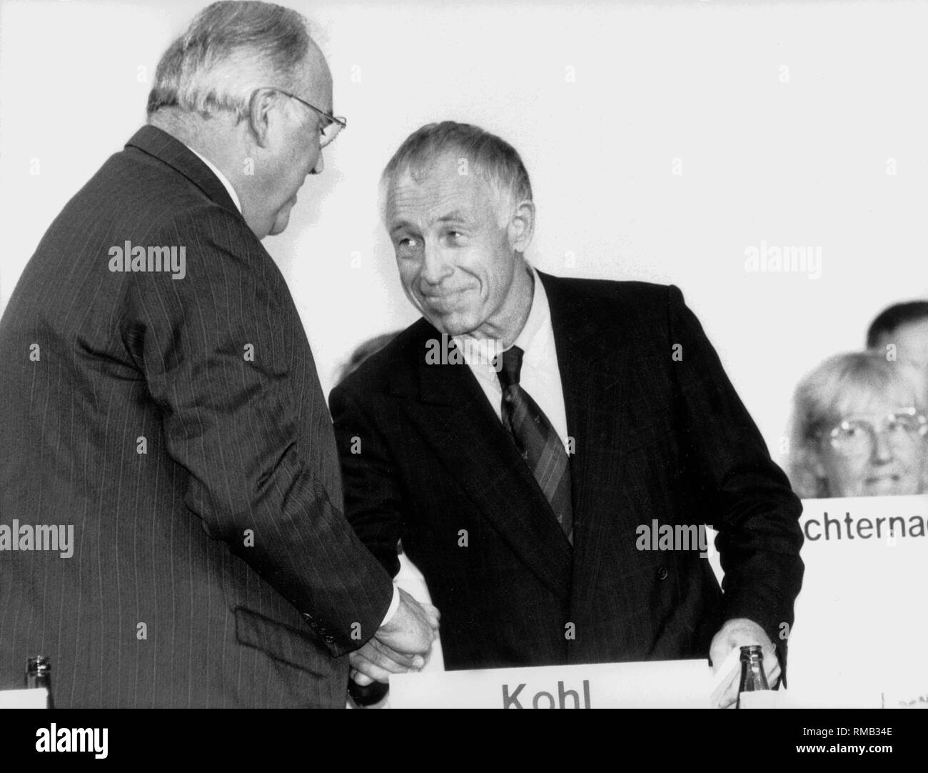 Chancellor and CDU party leader Helmut Kohl (left) and Secretary General Heiner Geissler shake hands at the CDU party convention in Bremen. Stock Photo