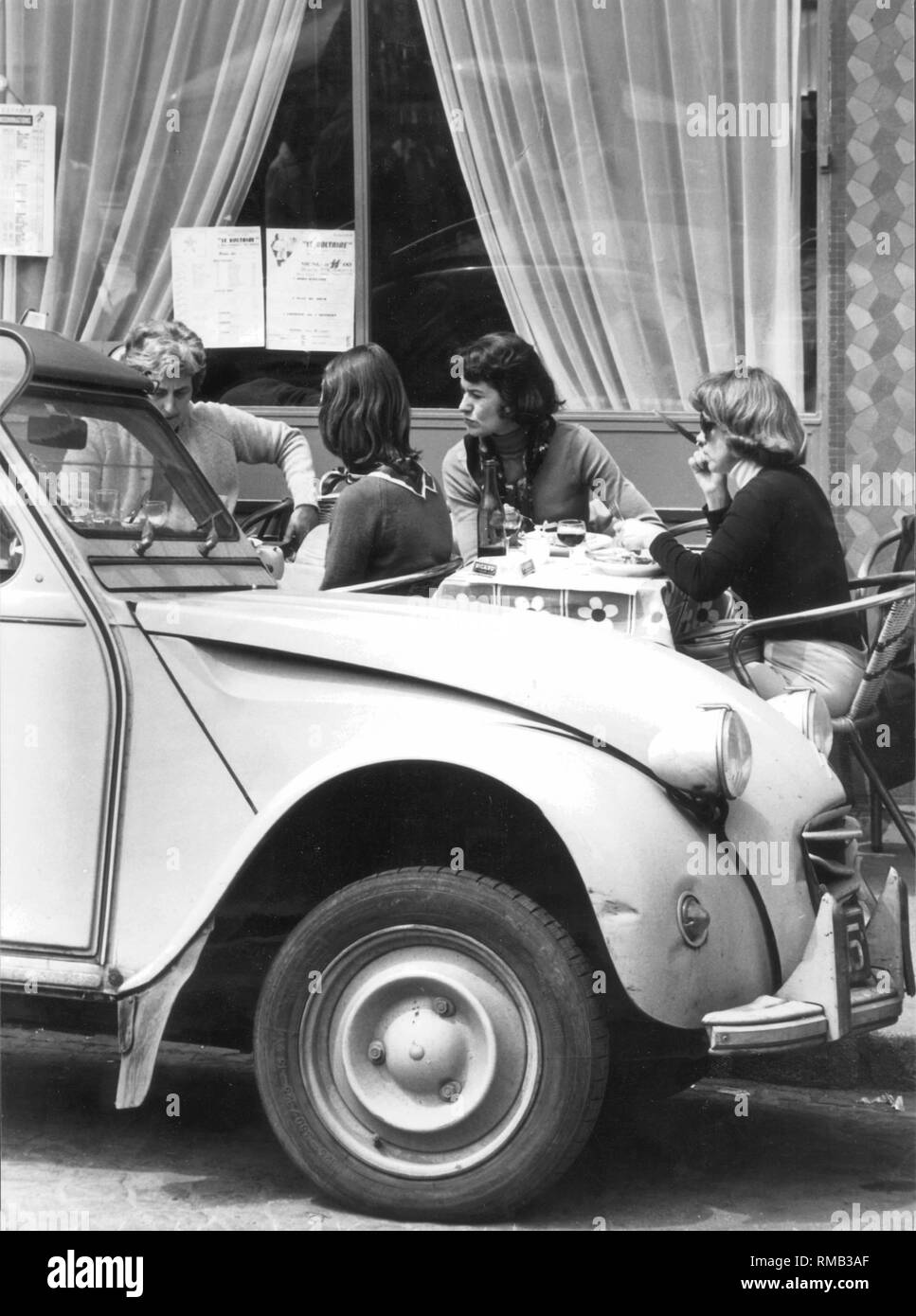 Street cafe in Paris in the 70s. Stock Photo