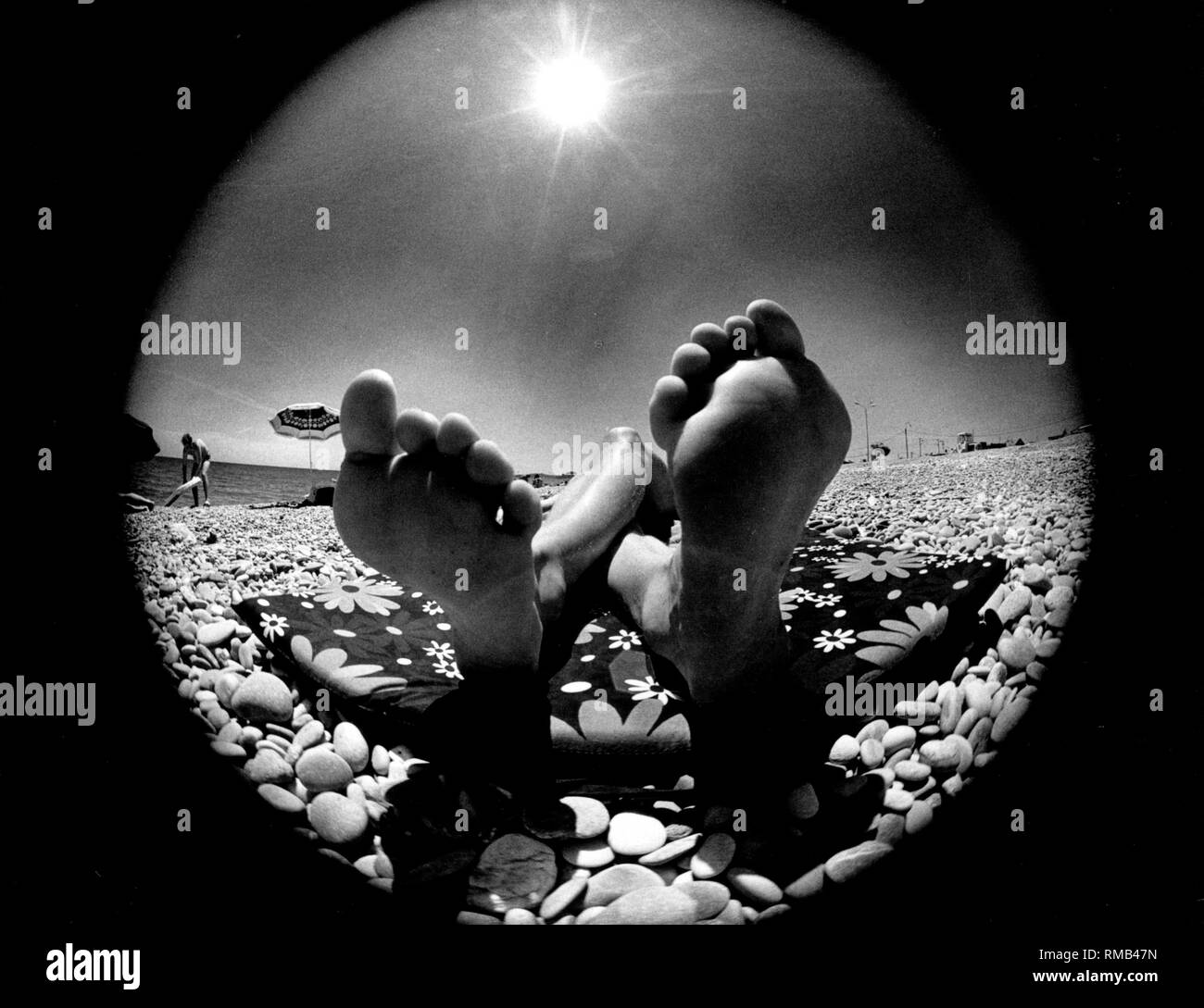 Sunbathing beach feet Black and White Stock Photos & Images Alamy