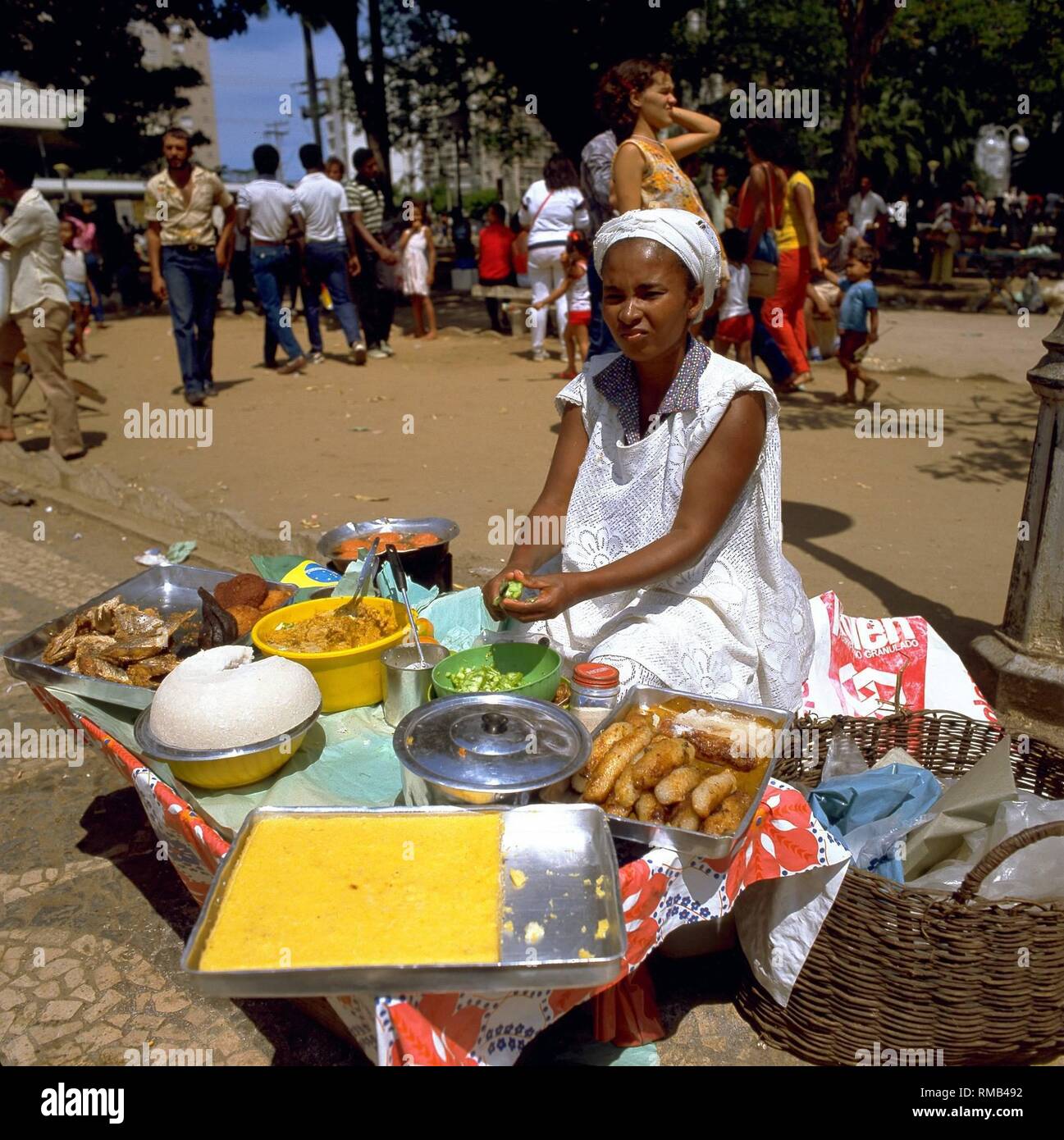 A woman sells local specialties at the flea market in Salvador. Stock Photo