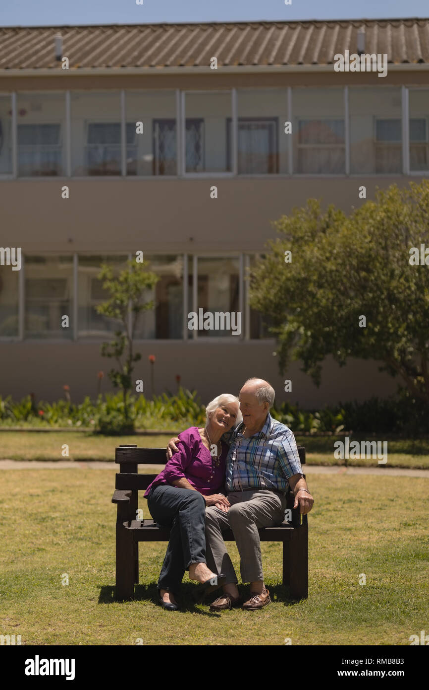 Senior couple sitting together on the bench in the park Stock Photo - Alamy