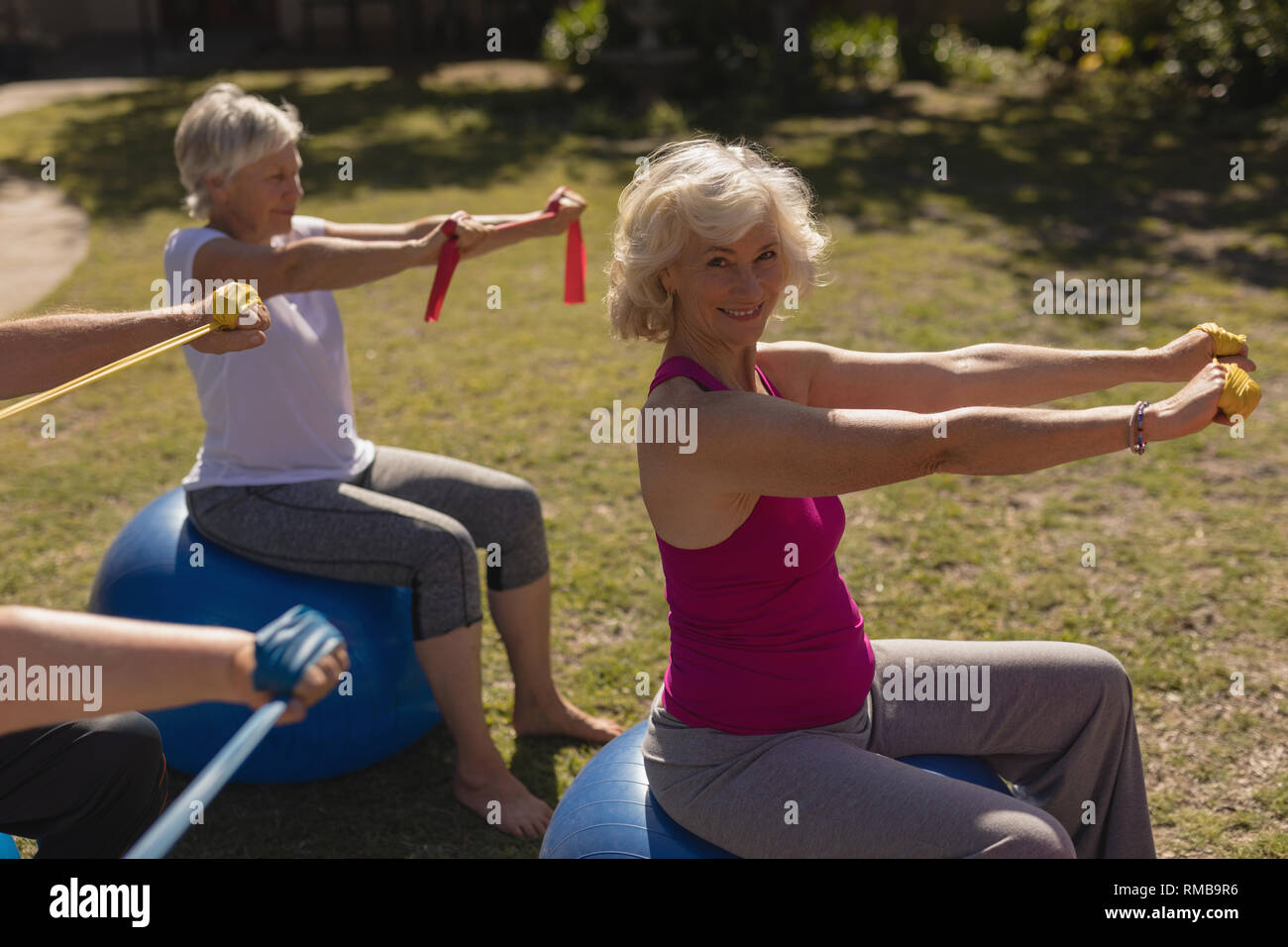 Group of senior people exercising in the park Stock Photo