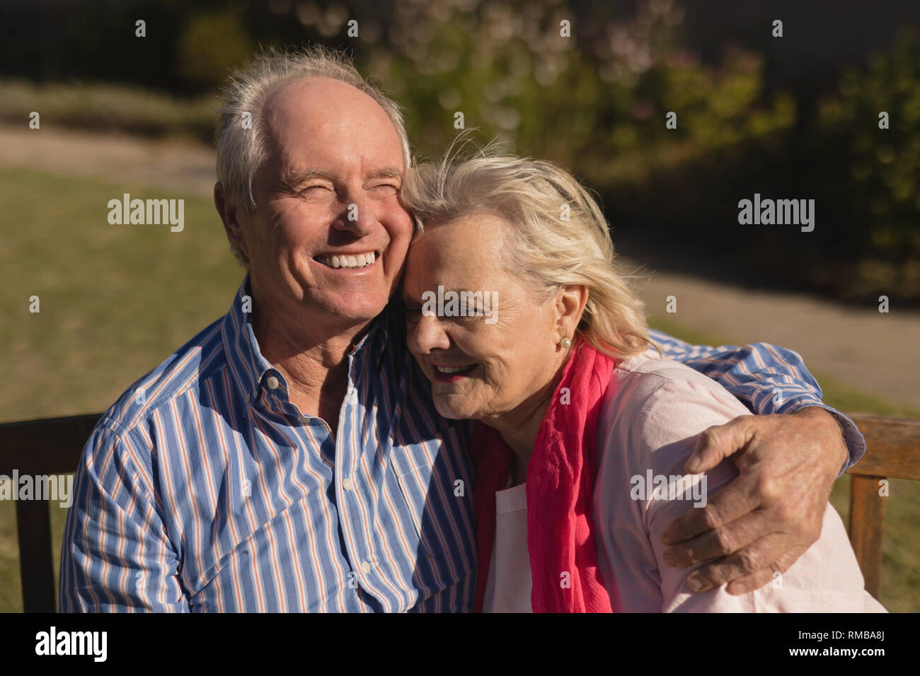 Senior couple embracing each other in the park Stock Photo