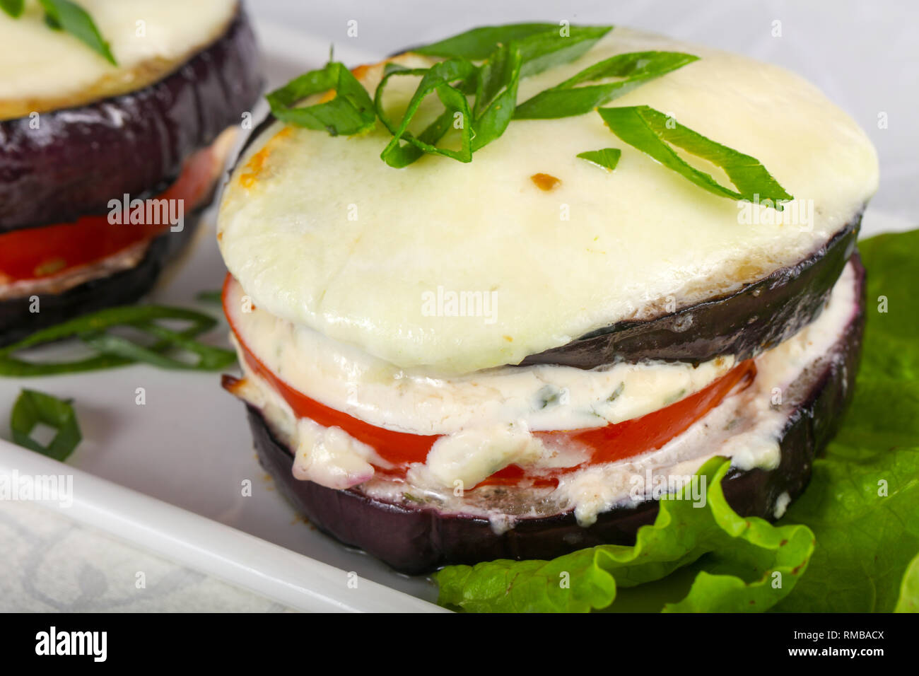 Baked eggplant with tomato and cheese Stock Photo Alamy