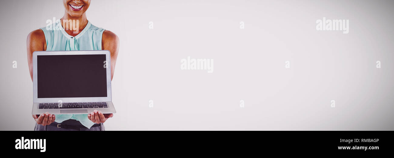Holding a laptop hi-res stock photography and images - Alamy