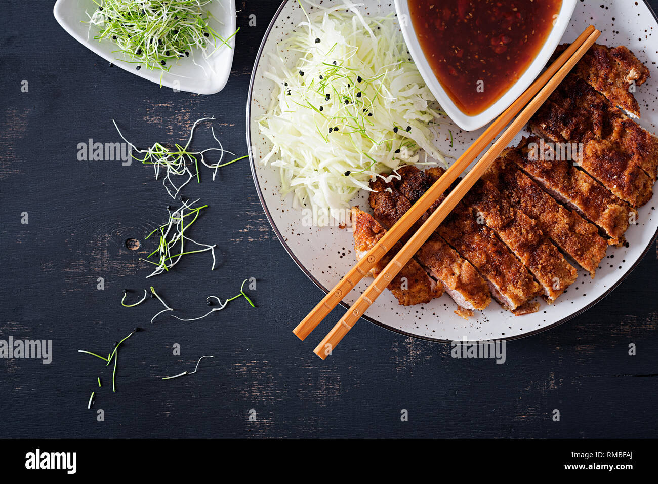 Japanese cuisine. Deepfried pork chop, or Japanese chop with cabbage