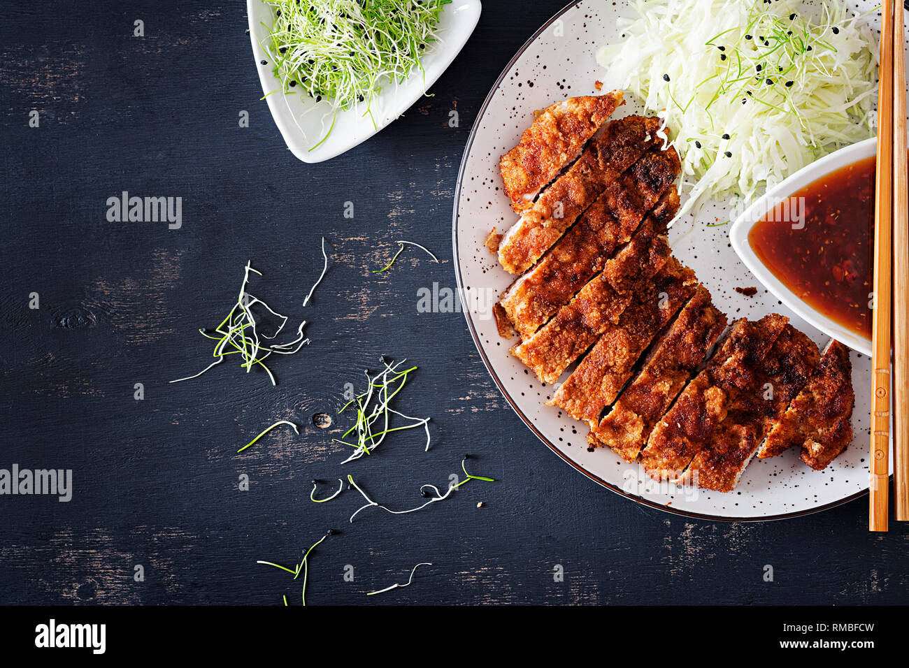 Japanese cuisine. Deepfried pork chop, or Japanese chop with cabbage