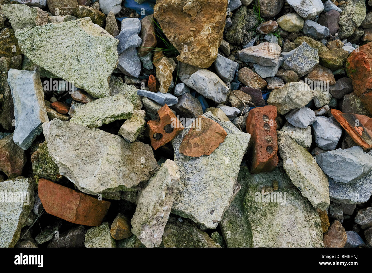 a small pile of mixed rubble including rocks, bricks and pebbles Stock Photo