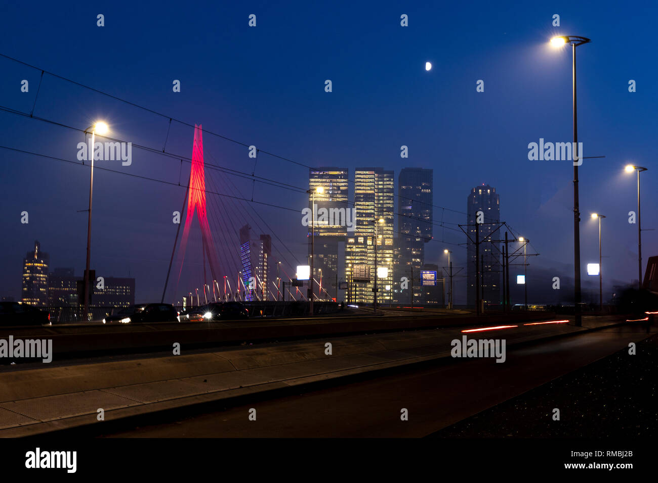 Rotterdam night time cityscape of the Erasmus bridge and skyscraper ...