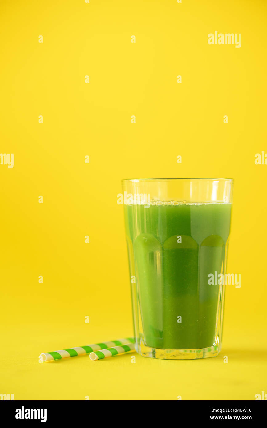 Glass Of Green Celery Smoothie On Yellow Background Banner With
