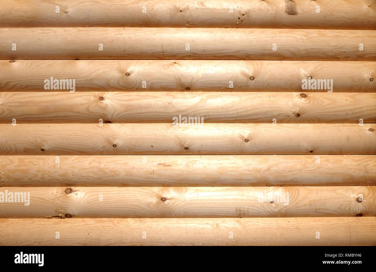 Background Of Horizontal Hewed Smooth Wooden Logs Close Up Stock