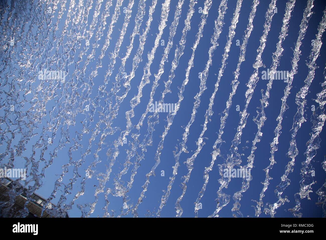 jets of water forming lines on the sky Stock Photo