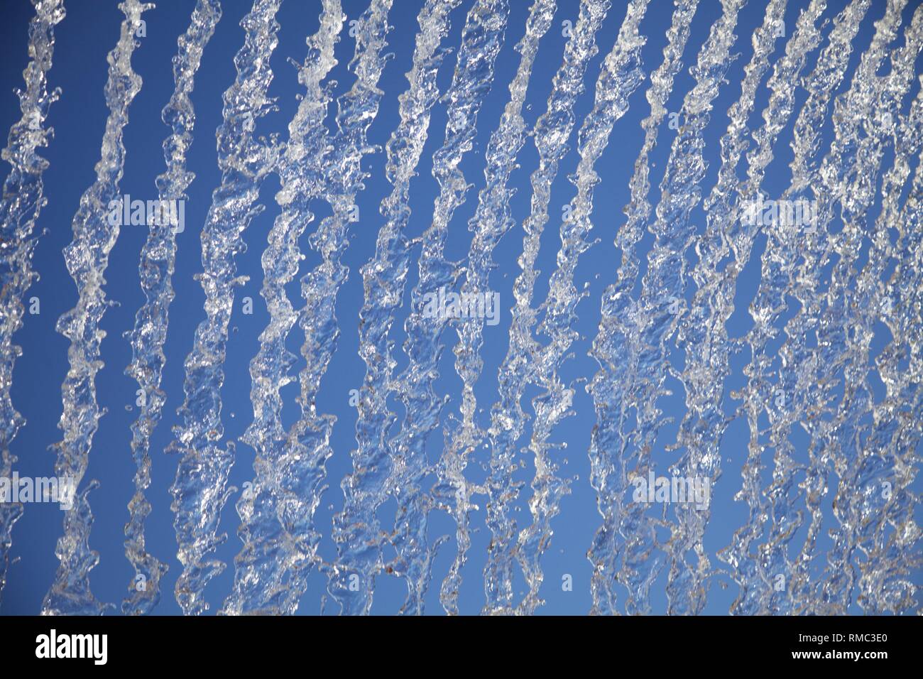 jets of water forming lines on the sky Stock Photo