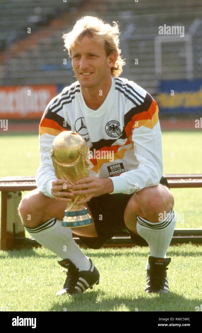 Germany wins the World Cup: Andreas Brehme with the World Cup trophy after the victorious final of the 1990 FIFA World Cup in Italy. Stock Photo