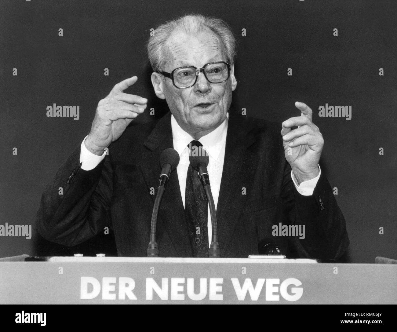 The Honorary Chairman of the reunited SPD, Willy Brandt, gives a speech at the unification party conference of the SPD in Berlin. Stock Photo