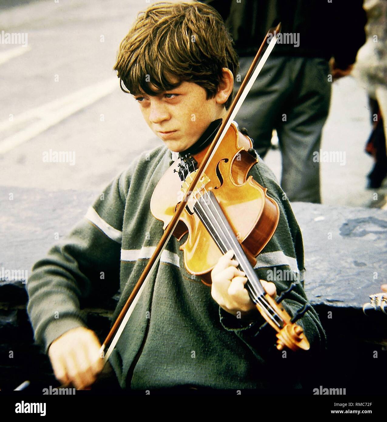 An Irish boy is playing on his violin Stock Photo Alamy