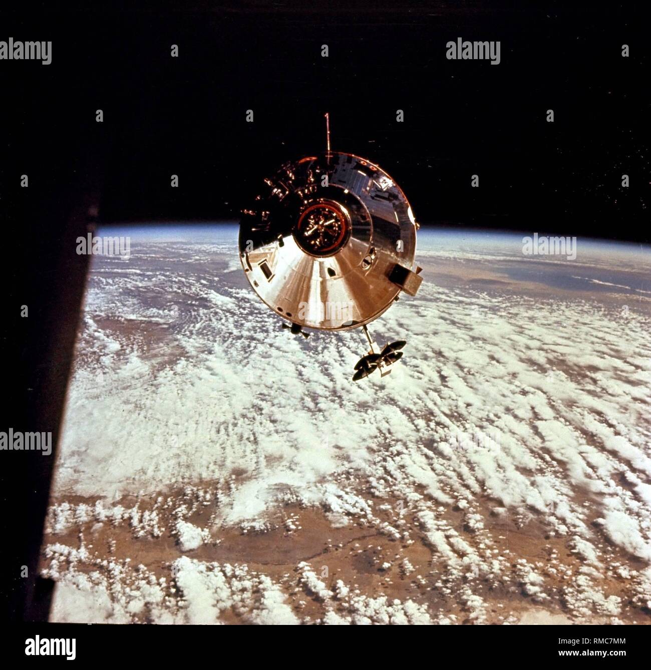 The Command Module 'Gumdrop' of the Apollo 9 mission above planet Earth photographed from the uncoupled Lunar Module 'Spider'. Apollo 9 (March 1969) was the first manned mission of an orbit around the earth that had all Apollo equipment and included the first flight of a Lunar Module. Stock Photo