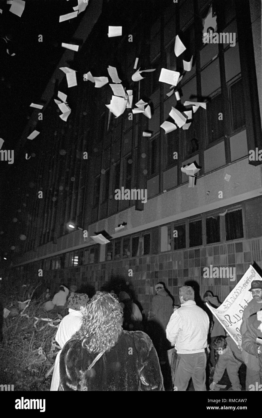 Occupation of the Stasi headquarters in Normannenstrasse, citizens throw files and other things 