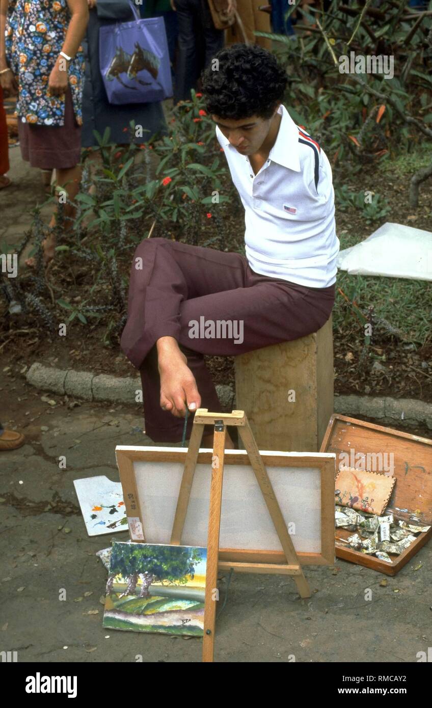 Disabled man as a foot painter in Belo Horizonte / Brazil (undated image) Stock Photo