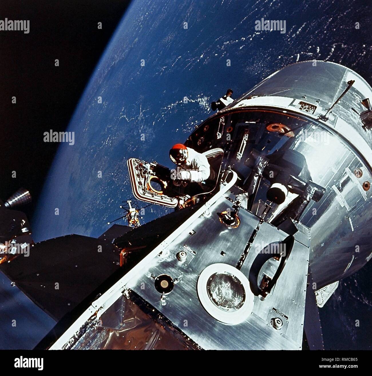 David R. Scott, astronaut of Apollo 9 doing an EVA exercise in the open hatch of the Command Module 'Gumdrop', which is paired with the Lunar Module 'Spider'. The photograph shows the spacecraft in its position above the Mississippi area. Apollo 9 (03.-13.03.1969) was the first manned mission of an orbit around the earth that had all Apollo equipment and included the first flight of a Lunar Module. Stock Photo