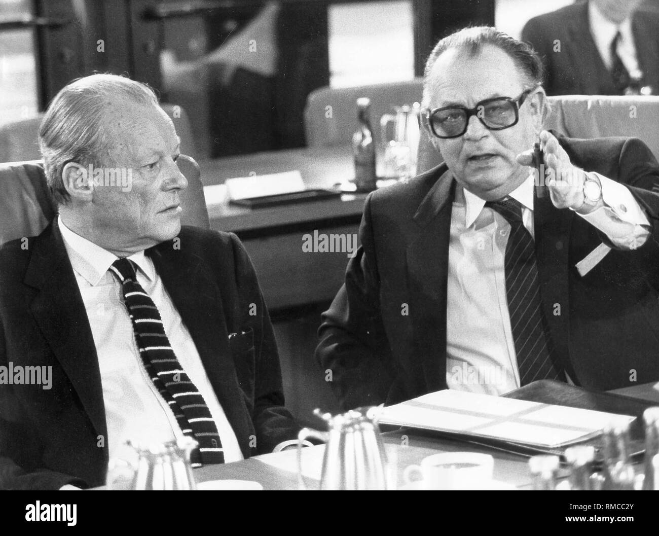 Willy Brandt, party leader of the SPD with his deputy Hans-Juergen Wischnewski. Stock Photo