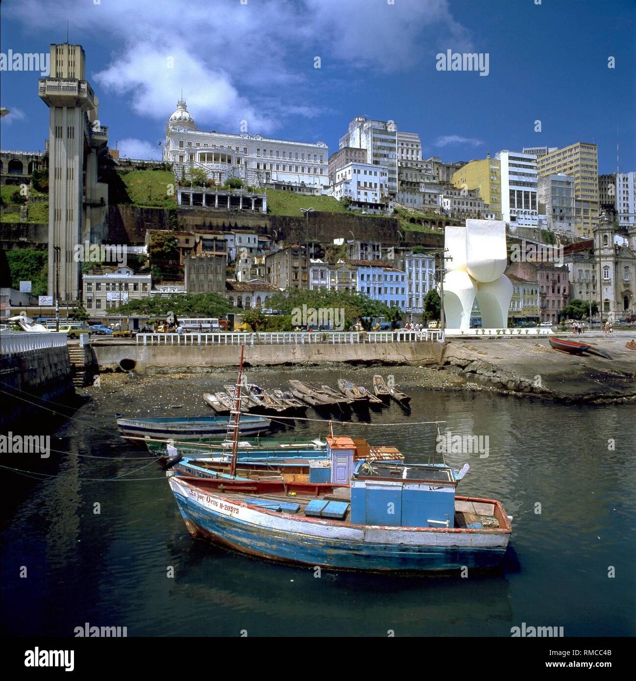 The old town of Salvador in Brazil, the fishing port and the urban elevator (left), which connects the Upper and Lower towns. Stock Photo