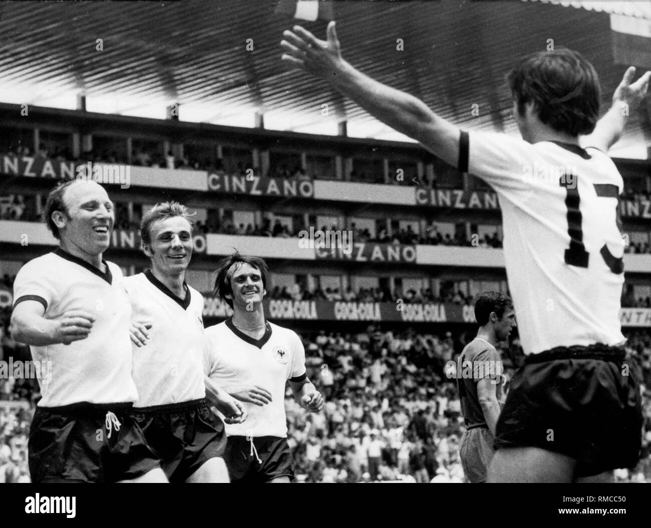 Uwe Seeler, Reinhard Libuda, Wolfgang Overrath (from left) and Gerd Mueller (13) rejoice at a goal scored at the FIFA World Cup in Mexico. Stock Photo